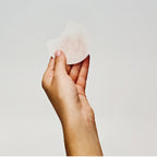 Glow Recipe Dew It Yourself Toner Pads Masking Kit close-up of a hydrating toner pad pressed onto the skin.