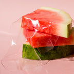 Watermelon Glow Jelly Sheet Mask packet shown alongside its individually wrapped two-piece mask.