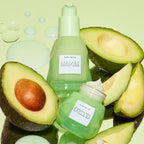 Close-up texture shot of Glow Recipe's Avocado Ceramide Recovery Serum's lightweight milky formula being pressed into skin.
